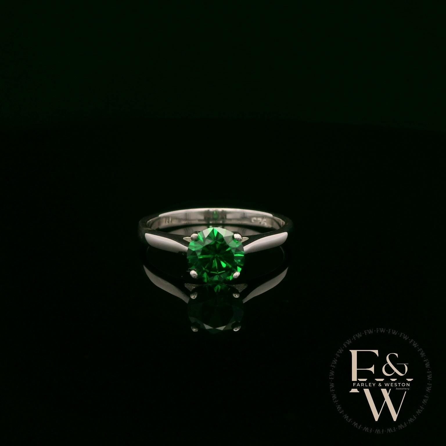 Solitaire Emerald & Silver Engagement Ring