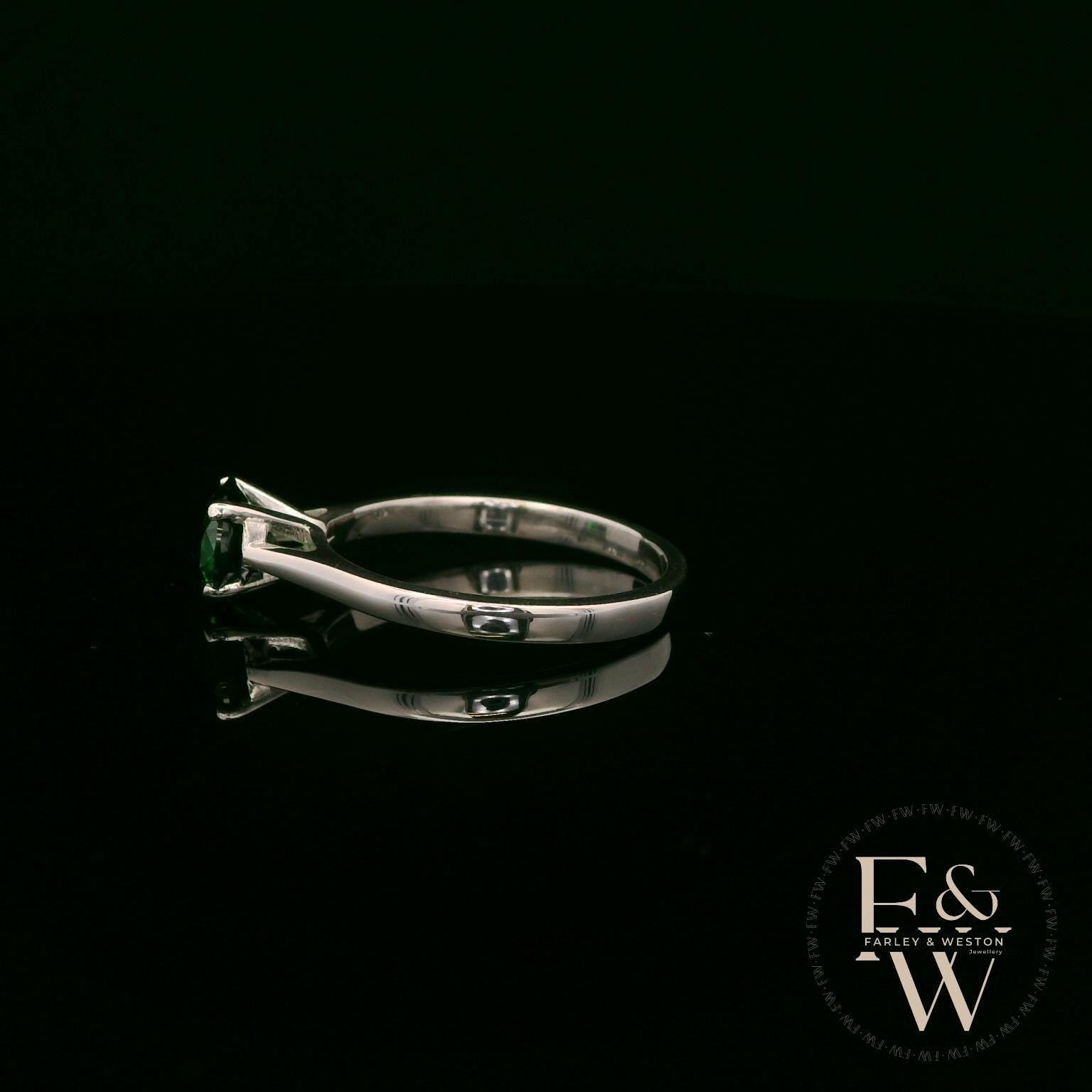 Solitaire Emerald & Silver Engagement Ring