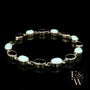 Sterling Silver Oval Cultured Opal and Garnet Bracelet
