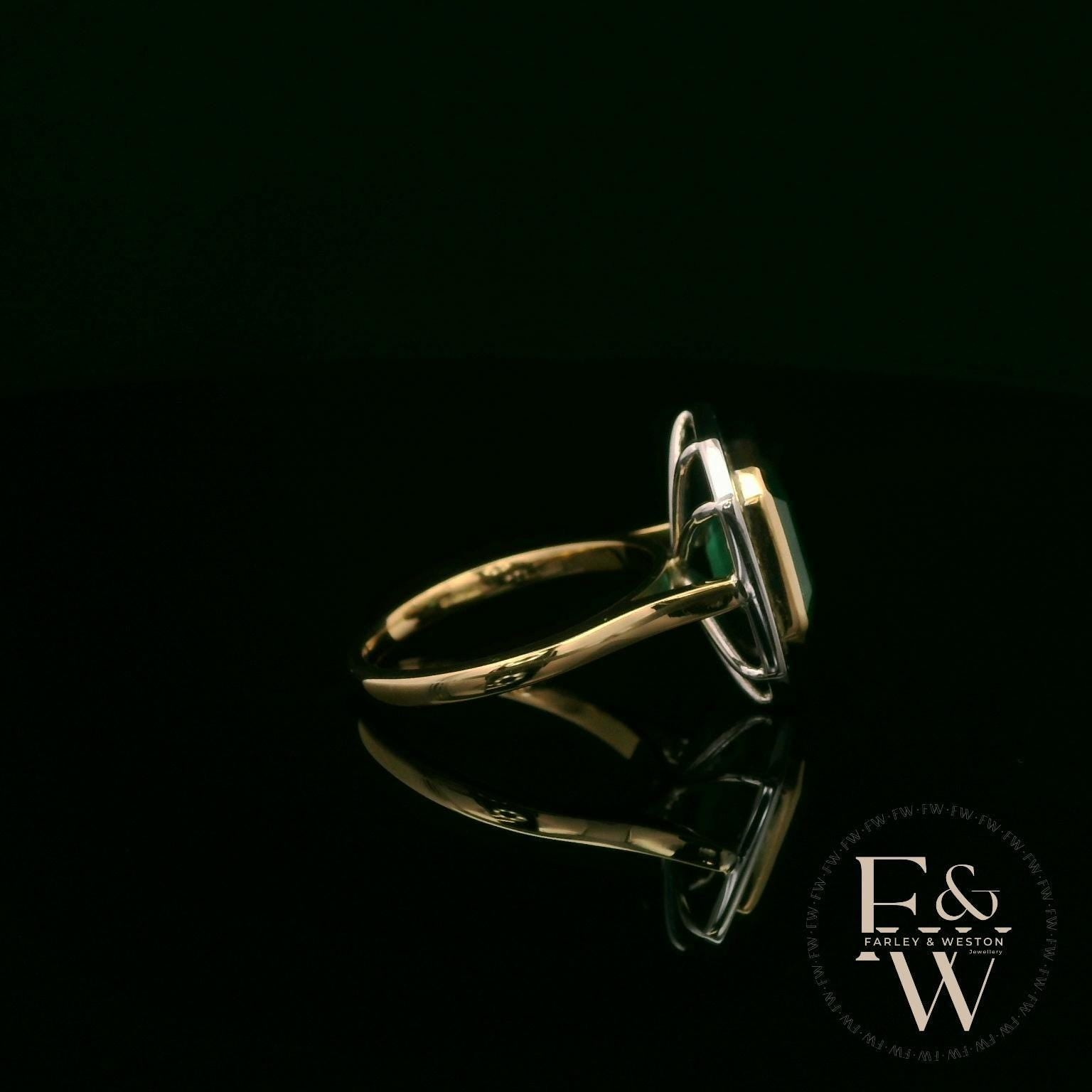 18ct White and Yellow Gold Emerald-Cut Emerald Diamond Halo Ring
