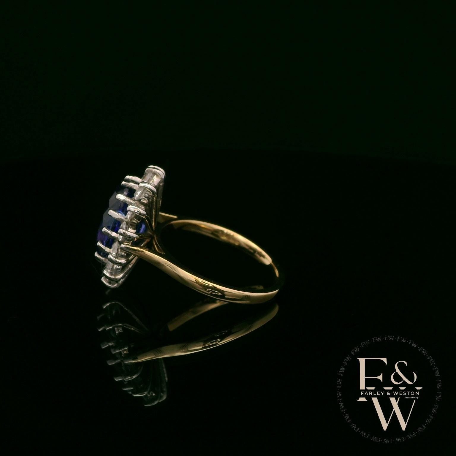 18ct White and Yellow Gold Oval-Cut Tanzanite & Diamond Halo Ring