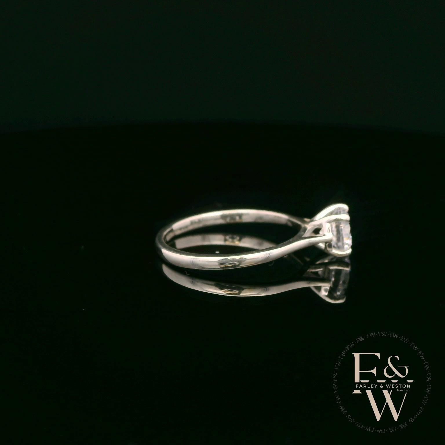 Sterling Silver Crossover Patterned White CZ Single Stone Ring