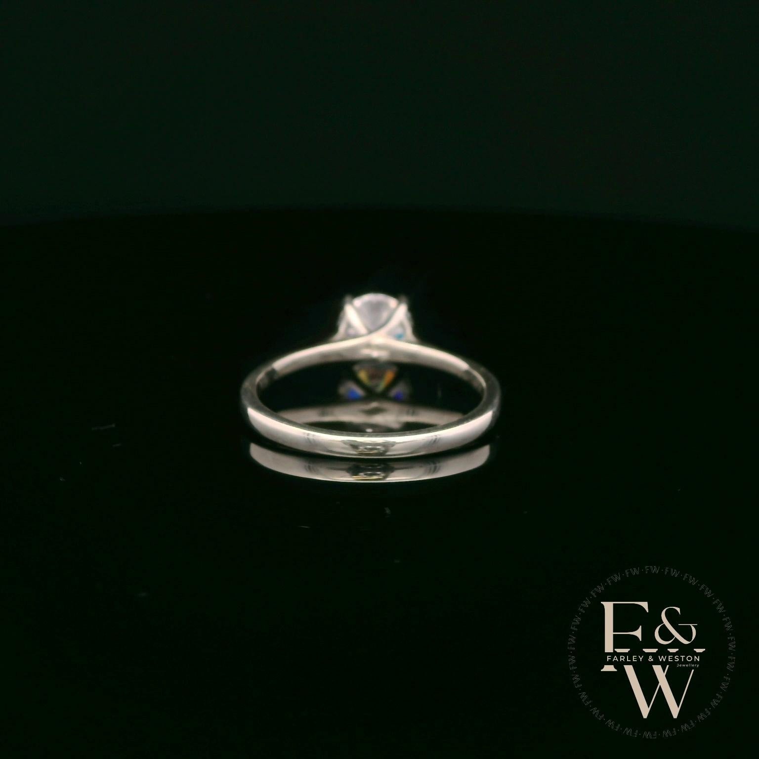 Sterling Silver Crossover Patterned White CZ Single Stone Ring