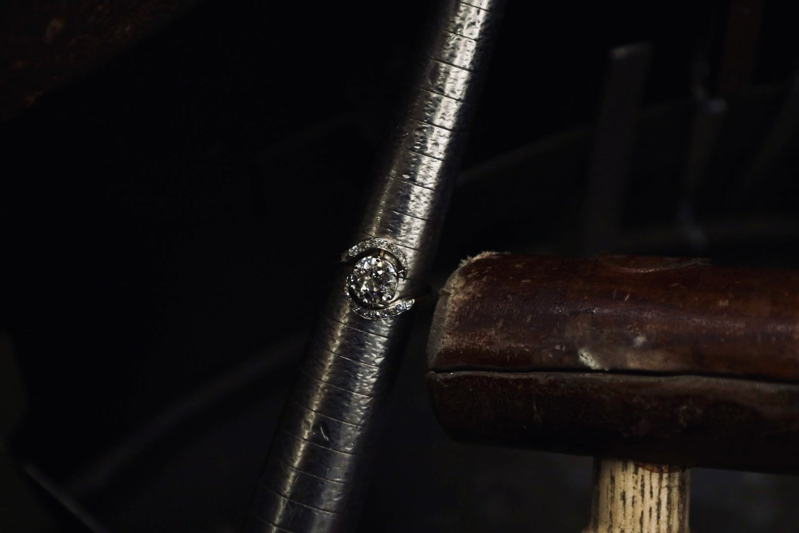 Close-up of a diamond ring on a dark background