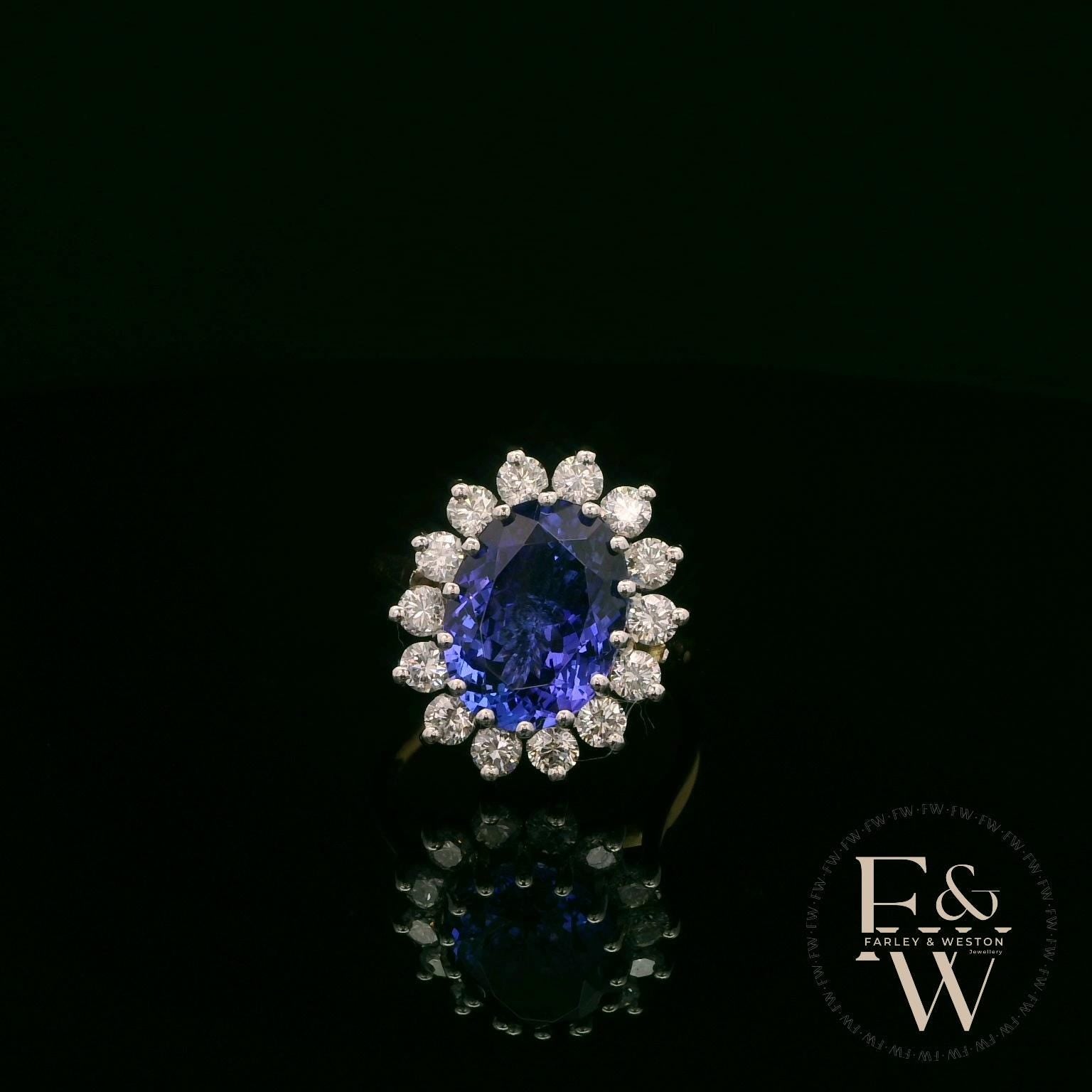 18ct White and Yellow Gold Oval-Cut Tanzanite & Diamond Halo Ring
